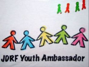 Lance’s JDRF Youth Ambassador shirt, adorned with Jelly Baby lapel pins.